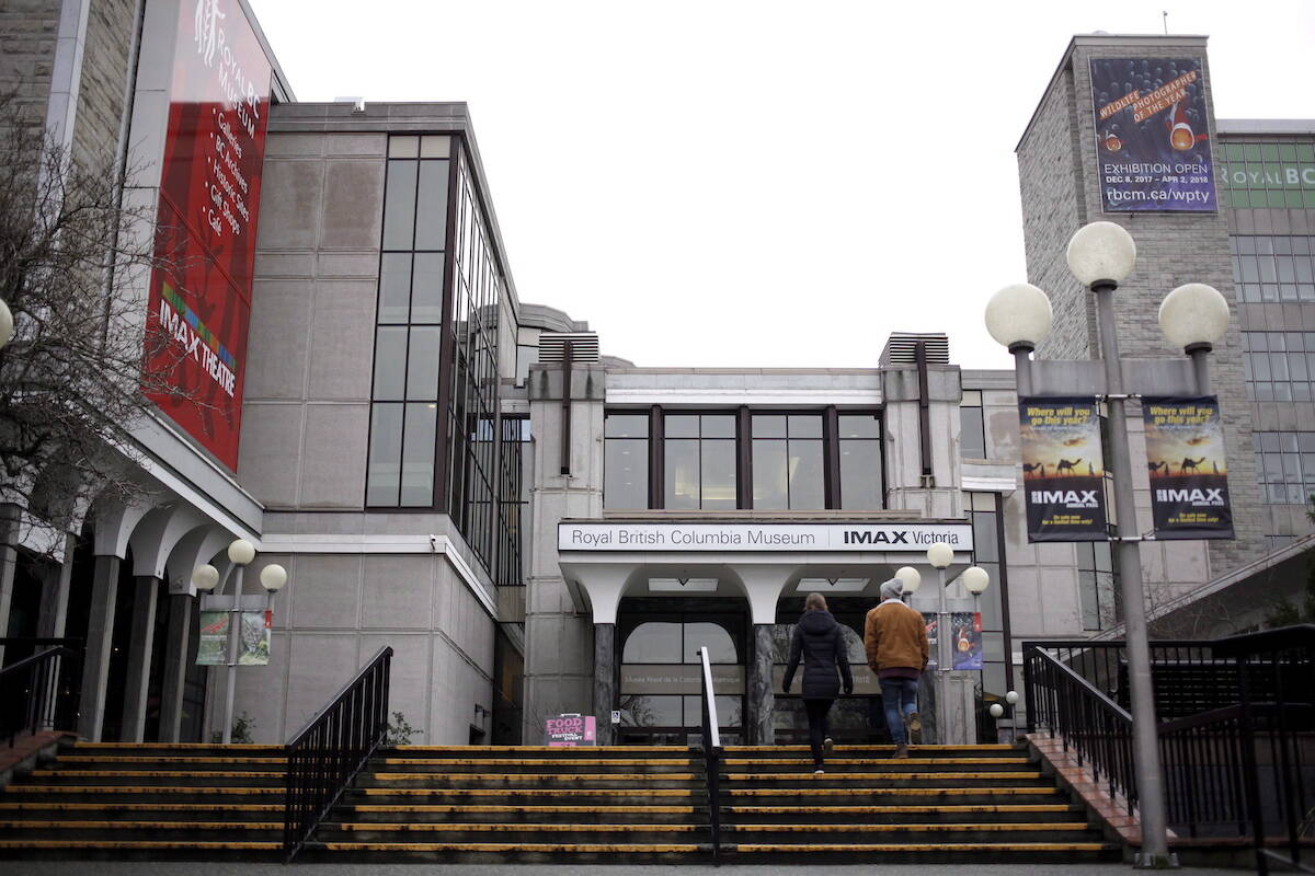 People walk up stairs to the entrance of the Royal BC Museum. (THE CANADIAN PRESS/Chad Hipolito)