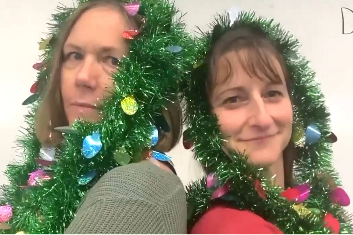 École Alberni Elementary School teachers Tammy Petrone and Sonia Organ wear tinsel as part of the teachers’ Christmas video, sung to Run-D.M.C.’s ‘Christmas in Hollis.’ (VIDEO SCREENSHOT)