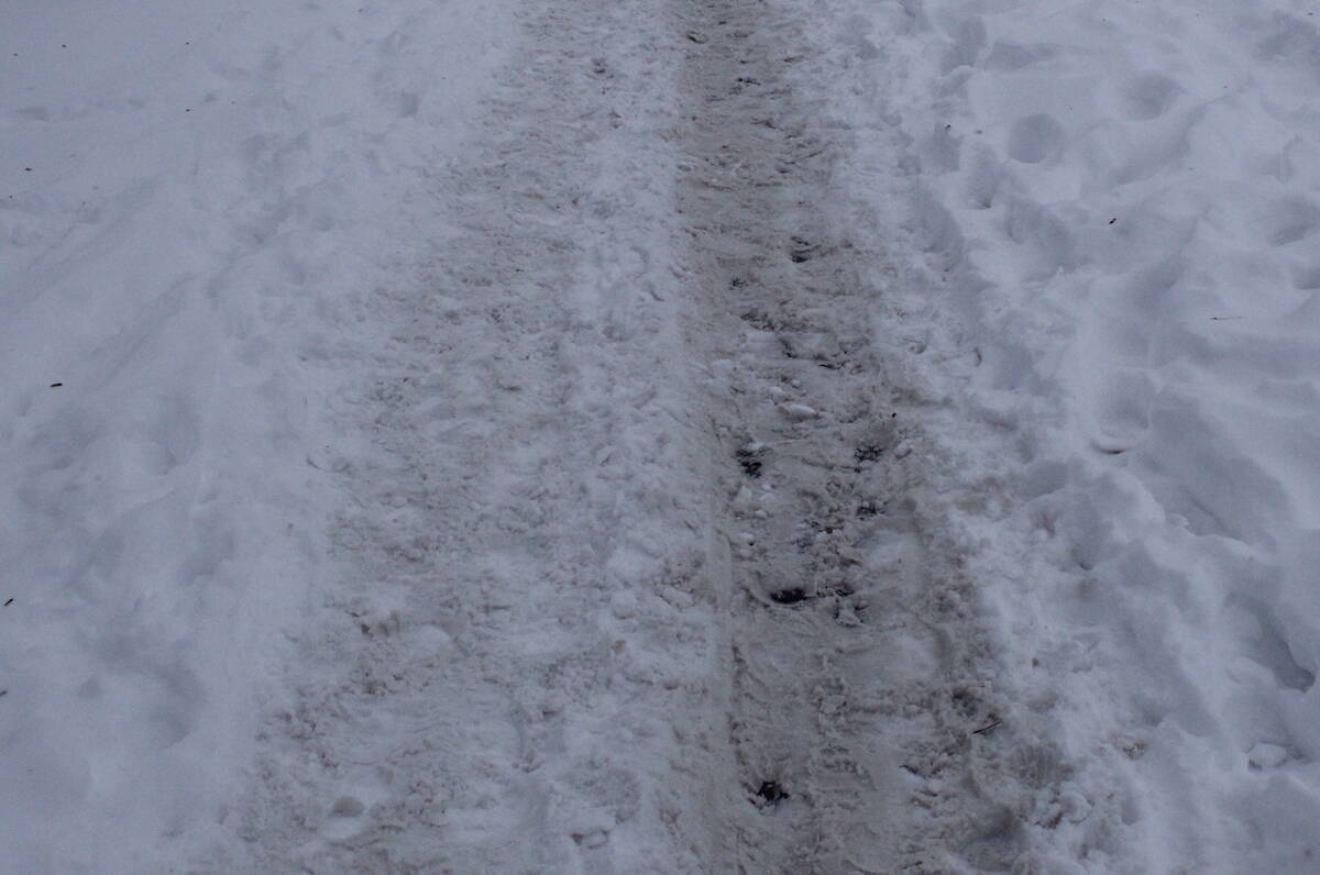 Many sidewalks in Greater Victoria are covered in snow. (Brendan Mayer/News Staff)