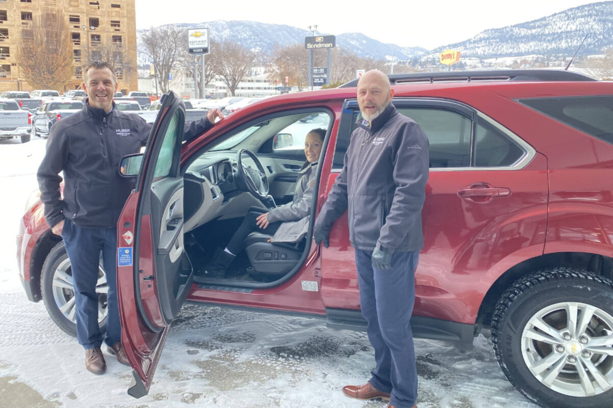 Kala Doneyhue pictured inside her 2010 Chevrolet Equinox, after winning Penticton’s Huber Bannister Christmas car giveaway on Dec. 23, 2022. (Logan Lockhart- Western News)