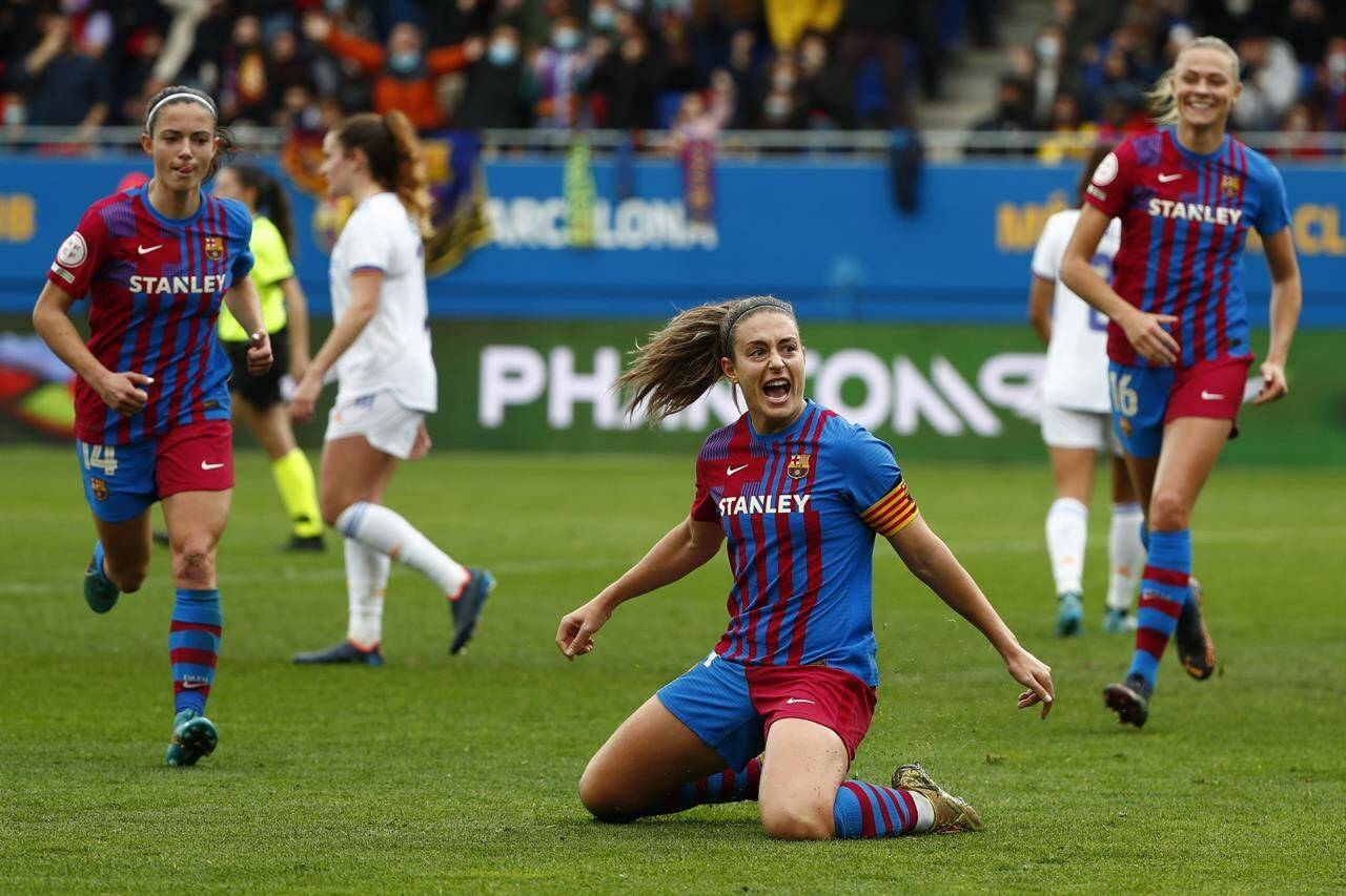 FILE - Barcelona’s Alexia Putellas celebrates after scoring her side’s second goal during the Women’s Spanish La Liga soccer match between Barcelona and Real Madrid at Johan Cruyff stadium in Barcelona, Spain, Sunday, March 13, 2022. (AP Photo/Joan Monfort, File)