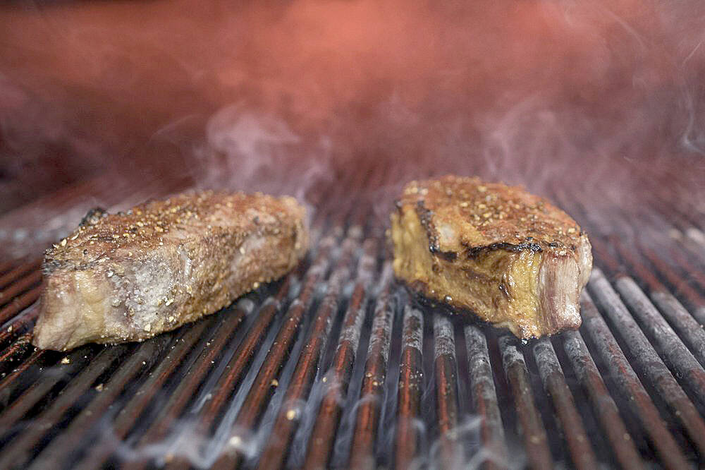Steaks on a grill in New York. (AP Photo/Mary Altaffer, File)