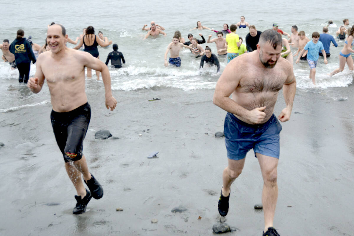 Swimmers head for dryland – and warmth – at the annual Polar Bear Swim in Sooke on Jan. 1. (File - Sooke News Mirror)