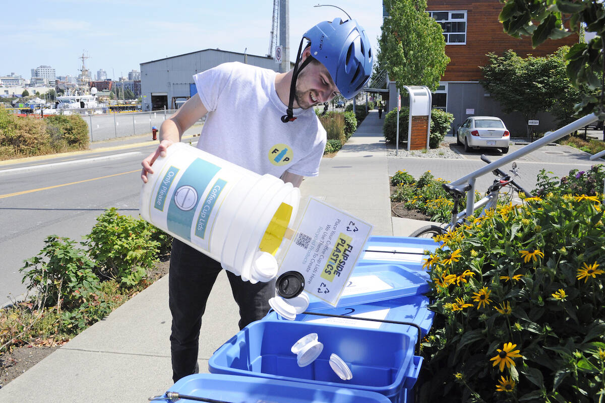 An employee of Flipside Plastics’ 2021 pilot project collects coffee lids from Caffe Fantastico in Victoria. The company was part of the 2020 Project Zero circular economy business incubator. (Courtesy of Flipside Plastics)