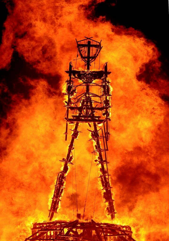 FILE - The “Man” burns on the Black Rock Desert at Burning Man near Gerlach, Nev., on Aug. 31, 2013. The Burning Man Project and four co-plaintiffs filed a new lawsuit in federal court in Reno this week accusing the Bureau of Land Management of breaking environmental laws in approving Ormat Nevada Inc.’s exploratory drilling in the Black Rock Desert 120 miles (193 kilometers) north of Reno. (Andy Barron /The Reno Gazette-Journal via AP)