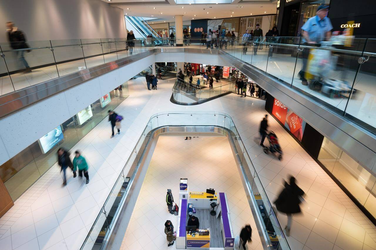 People make their way around the Rideau Center shopping centre on Boxing Day in Ottawa, on Monday, Dec. 26, 2022. Statistics Canada will release its inflation report for December this morning. The federal agency’s consumer price index report will provide insight on how quickly prices rose last month as Canada continues to struggle with decades-high inflation.THE CANADIAN PRESS/Spencer Colby