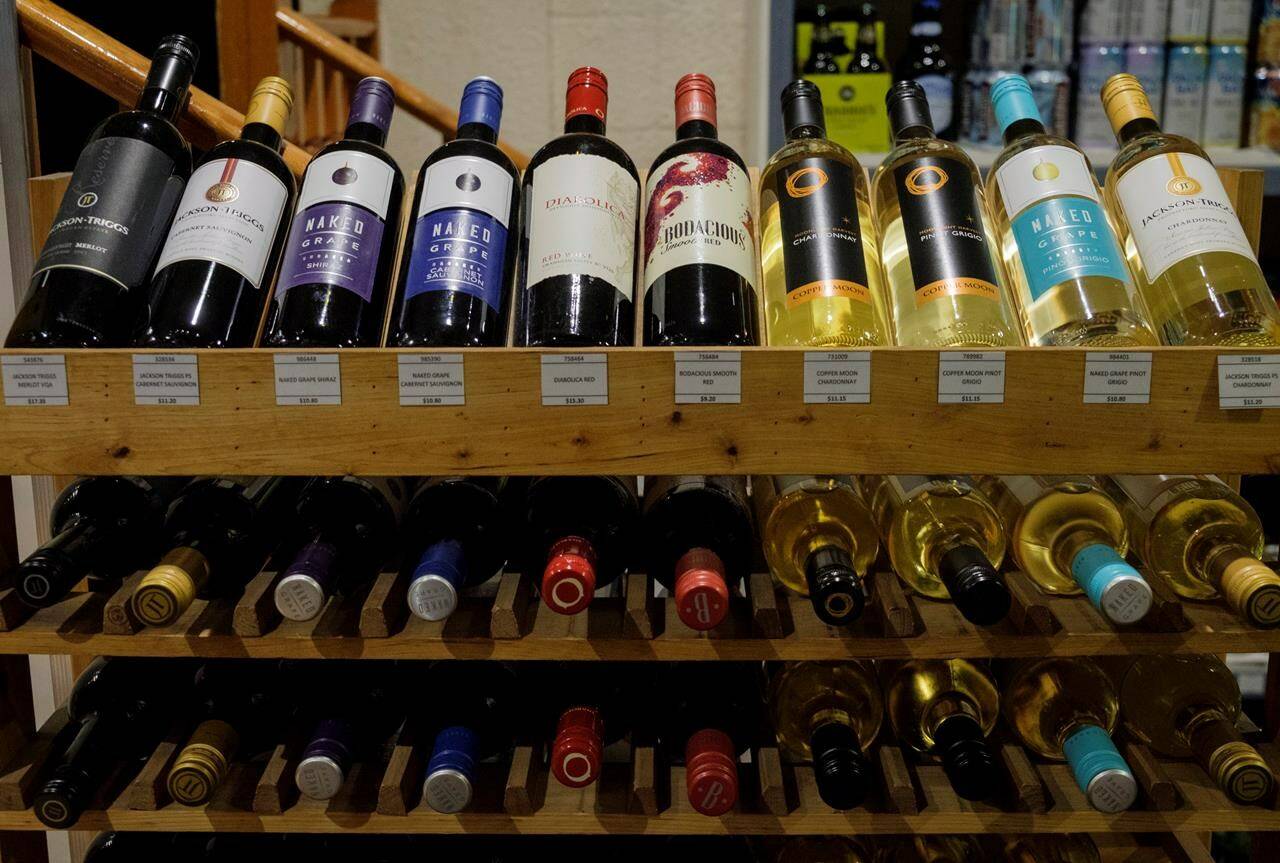 Representatives from Canada’s alcohol industry say mandatory warning labels are not needed on booze containers as suggested in guidance that greatly reduces the amount Canadians should be drinking due to health risks including seven types of cancer. Bottles of British Columbia wine on display at a liquor store in Cremona, Alta., on Feb. 7, 2018. THE CANADIAN PRESS/Jeff McIntosh