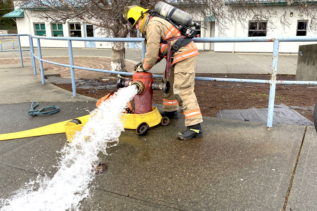 A recruits gets down to work in a training session. Sooke, Metchosin, and East Sooke fire departments are training 13 recruits to become firefighters over the next several months. (Sooke Fire Rescue – Facebook)