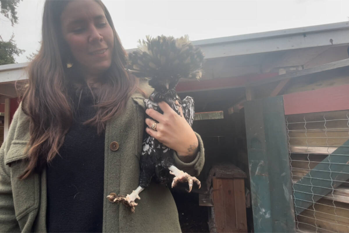 Jess Duncan holds Toque the shy chicken at Bear ‘N Bee Therapeutic Farm. (Hollie Ferguson/News Staff)