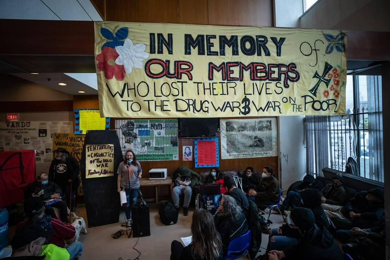 Laura Shaver, back left, speaks at a gathering to remember those who died from a suspected illicit drug overdose, in Vancouver, on Wednesday, February 9, 2022. British Columbia is introducing a policy of decriminalization on Tuesday as part of what it says is an overall plan in its fight against overdose deaths from illicit drugs. THE CANADIAN PRESS/Darryl Dyck
Laura Shaver, back left, speaks at a gathering to remember those who died from a suspected illicit drug overdose, in Vancouver, on Wednesday, February 9, 2022. British Columbia is introducing a policy of decriminalization on Tuesday as part of what it says is an overall plan in its fight against overdose deaths from illicit drugs. THE CANADIAN PRESS/Darryl Dyck