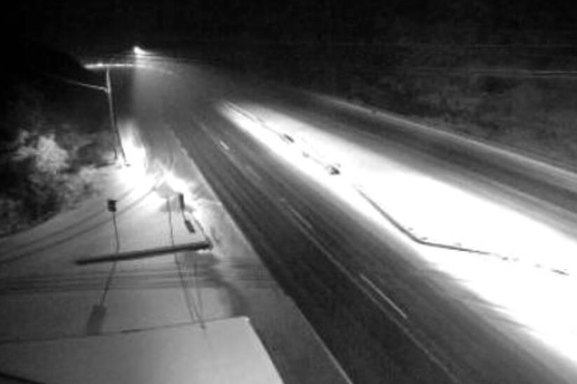 The DriveBC traffic camera on the Trans-Canada Highway at Okotoks Road, looking north, shortly before 6 a.m. Tuesday, Jan. 31. (DriveBC traffic camera)