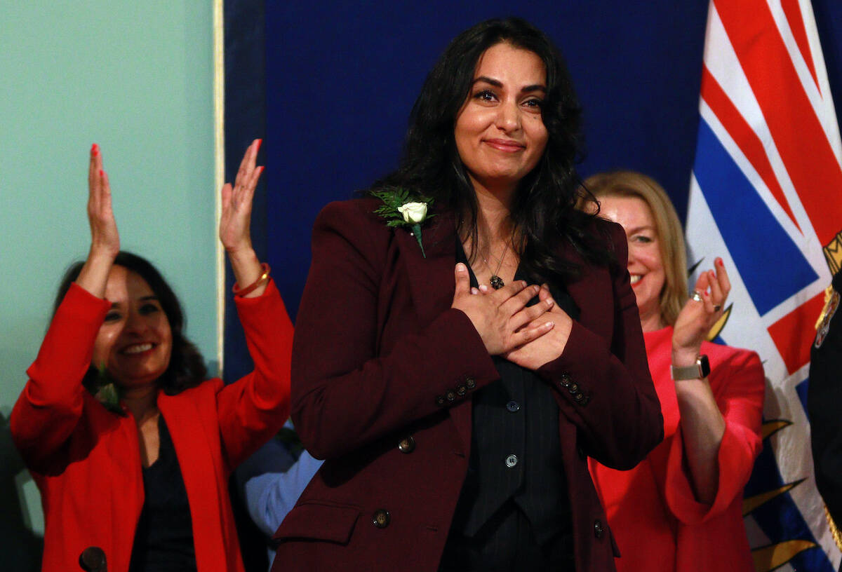 B.C. Attorney General Niki Sharma looks on during the swearing-in ceremony at Government House in Victoria, B.C., on Wednesday, December 7, 2022. THE CANADIAN PRESS/Chad Hipolito