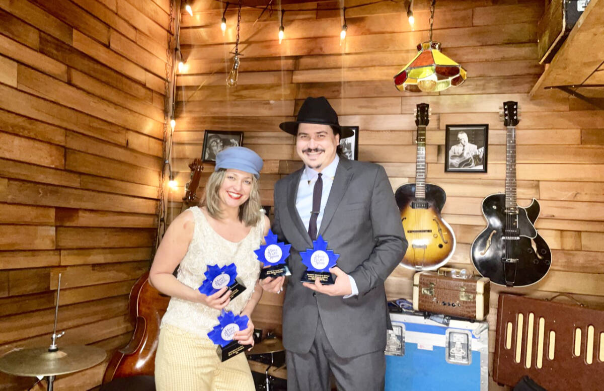 Jasmine Colette and A.W. Cardinal in their home studio with their four coveted Maple Blues Awards for 2023. (Photo courtesy Blue Moon Marquee)