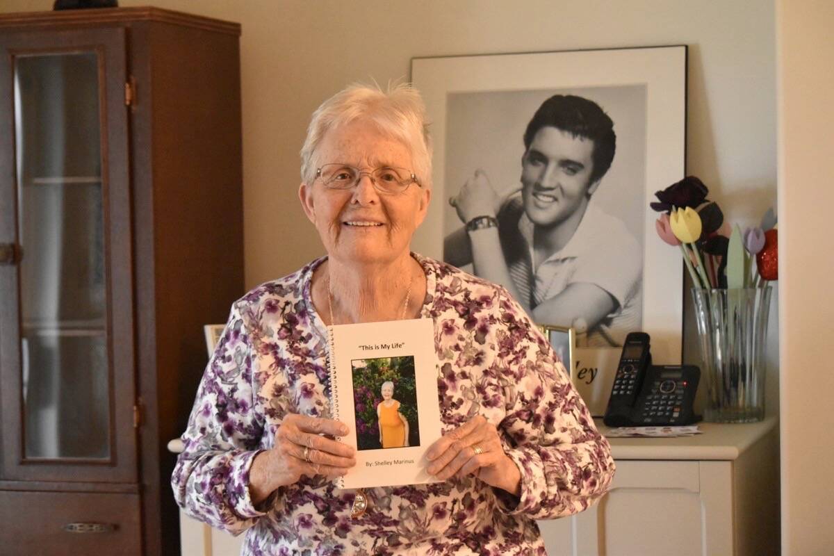 Shelley Marinus, pictured with her favourite rock star, holds a copy of This is My Life. She is hosting a book signing Feb. 27 at the Filberg Centre. Scott Stanfield photo
