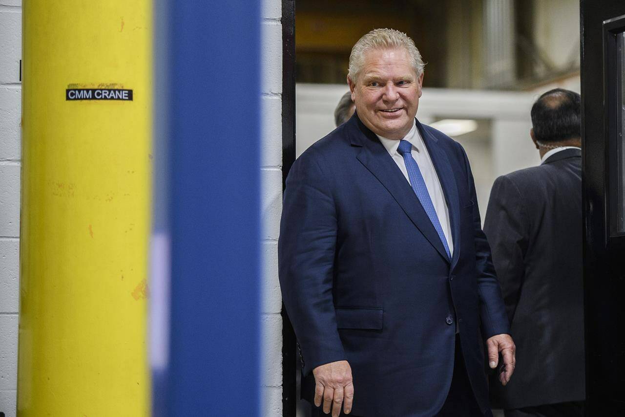 Ontario Premier Doug Ford tours a laboratory in Brampton, Ont., on Wednesday, February 15, 2023. THE CANADIAN PRESS/Christopher Katsarov