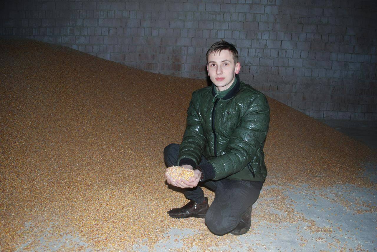 Farmer and Ukrainian military volunteer Oleh His inspects his grain crop in the small town of Cherneve in western Ukraine on Sunday, Feb. 19, 2023. He’s received several grain storage sleeves from Canada through the UN Food and Agriculture Organization after the Russian invasion destabilized the country’s food supply. THE CANADIAN PRESS/Laura Osman