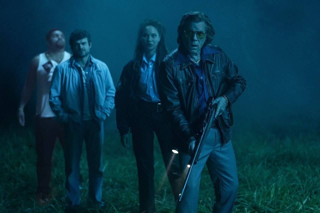 This image released by Universal Pictures shows O’Shea Jackson, Jr., from left, Alden Ehrenreich, Ayoola Smart and Ray Liotta in a scene from “Cocaine Bear,” directed by Elizabeth Banks. (Pat Redmond/Universal Pictures via AP)