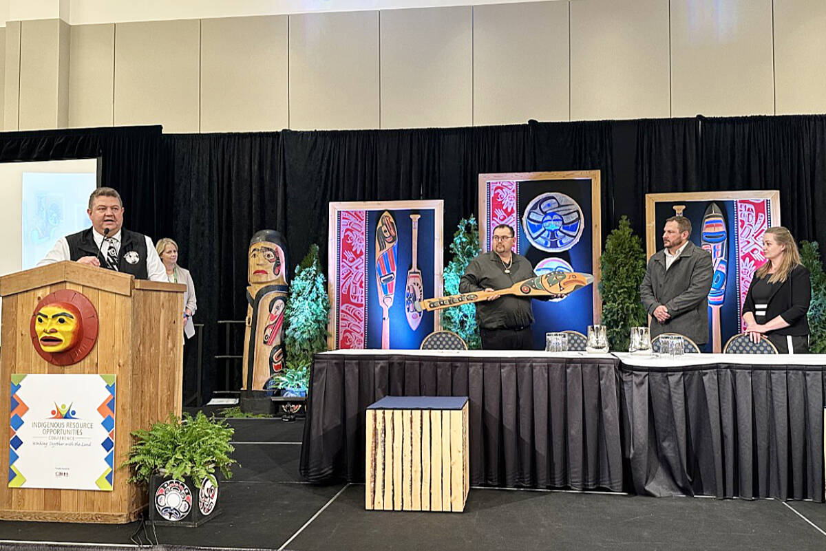 Wei Wai Kum Chief Chris Roberts (left) speaks at the signing of a protocol Feb. 27, 2023 in Nanaimo between the Wei Wai Kum First Nation, We Wai Kai First Nation and the Myra Falls Mine. We Wai Kai Chief Ronnie Chickite holds a carved paddle to be presented to Myra Falls general manager Adam Foulstone. Photo contributed