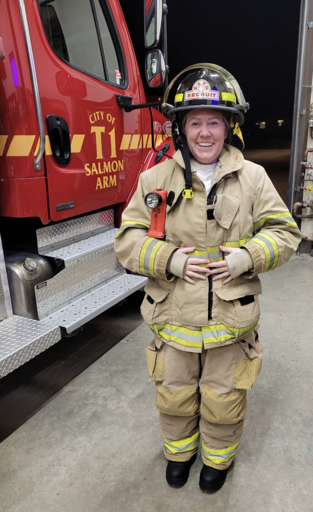 Tammy Young beams with excitement when she returns from her first call with the Salmon Arm Fire Department. (Photo contributed)