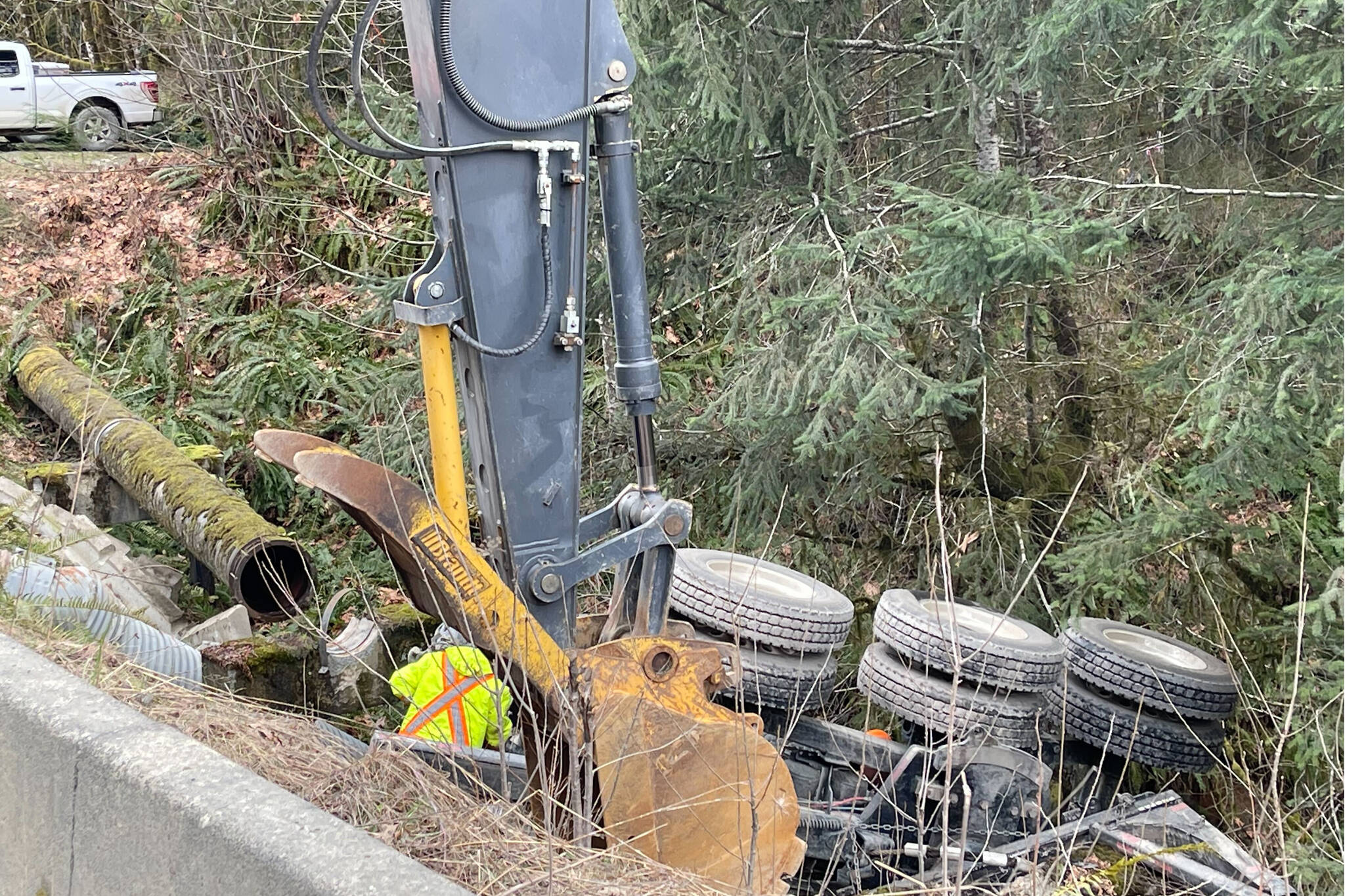 Emergency crews respond to a logging truck crash on Franklin River Road just outside the City of Port Alberni on March 9, 2023. (SUSAN QUINN / ALBERNI VALLEY NEWS)