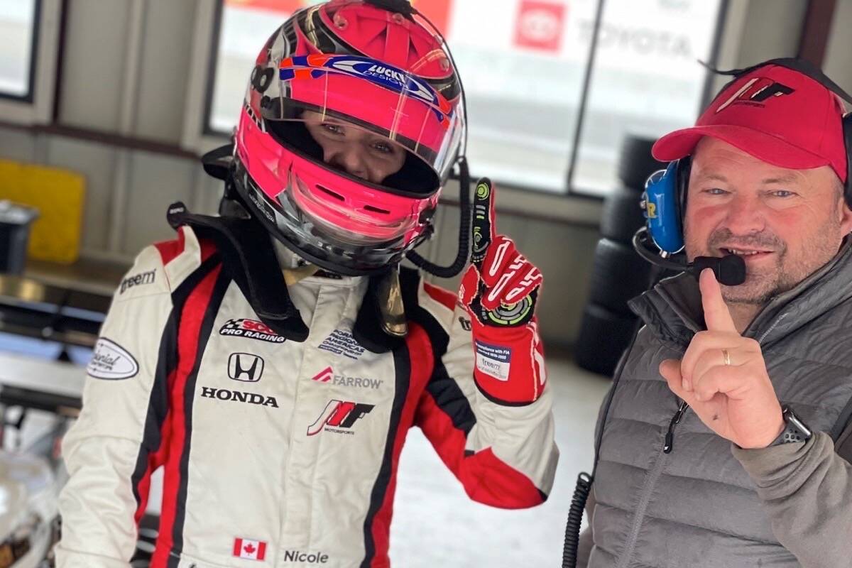 Nicole Havrda and her coach at the race track. Photo supplied