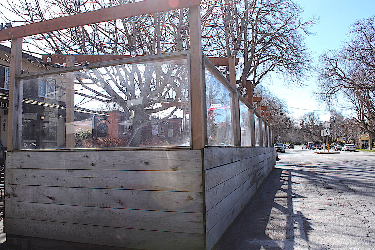 A patio structure in Cook Street Village in March. Victoria is set to bring in a bylaw transition from its pandemic patio program. (Jake Romphf/News Staff)