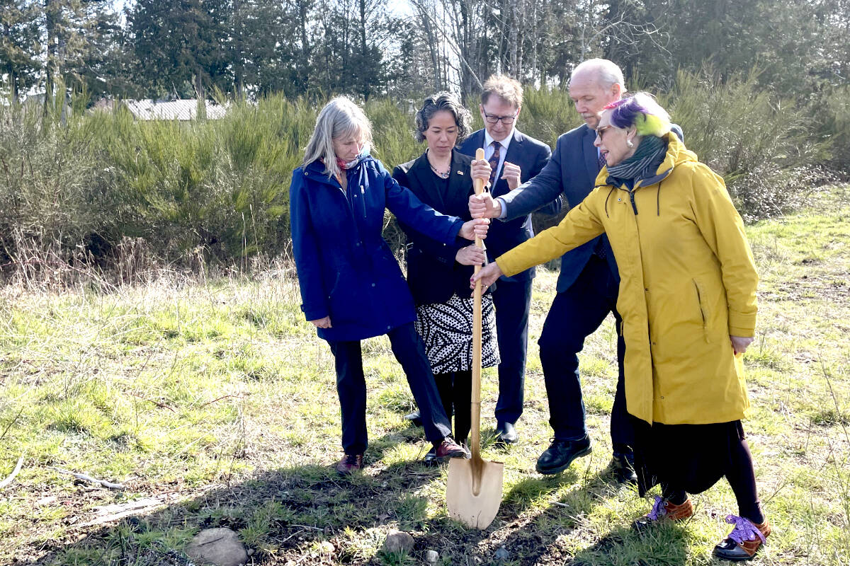 Members of the Sooke Region Communities Health Network, Island Health, John Horgan and Adrian Dix break ground where the new centre will be located in Sooke on March 16, 2023. (Hollie Ferguson - Black Press Media)