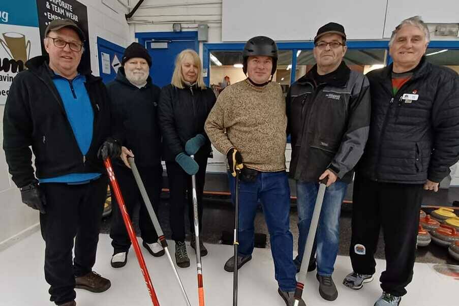 The Campbell River Blind Curling team are from left to right Richard (sighted guide), Kelvin, Maureen, Jeremy, Arthur, and Bruce (Coach). Photo courtesy Kelvin Adams