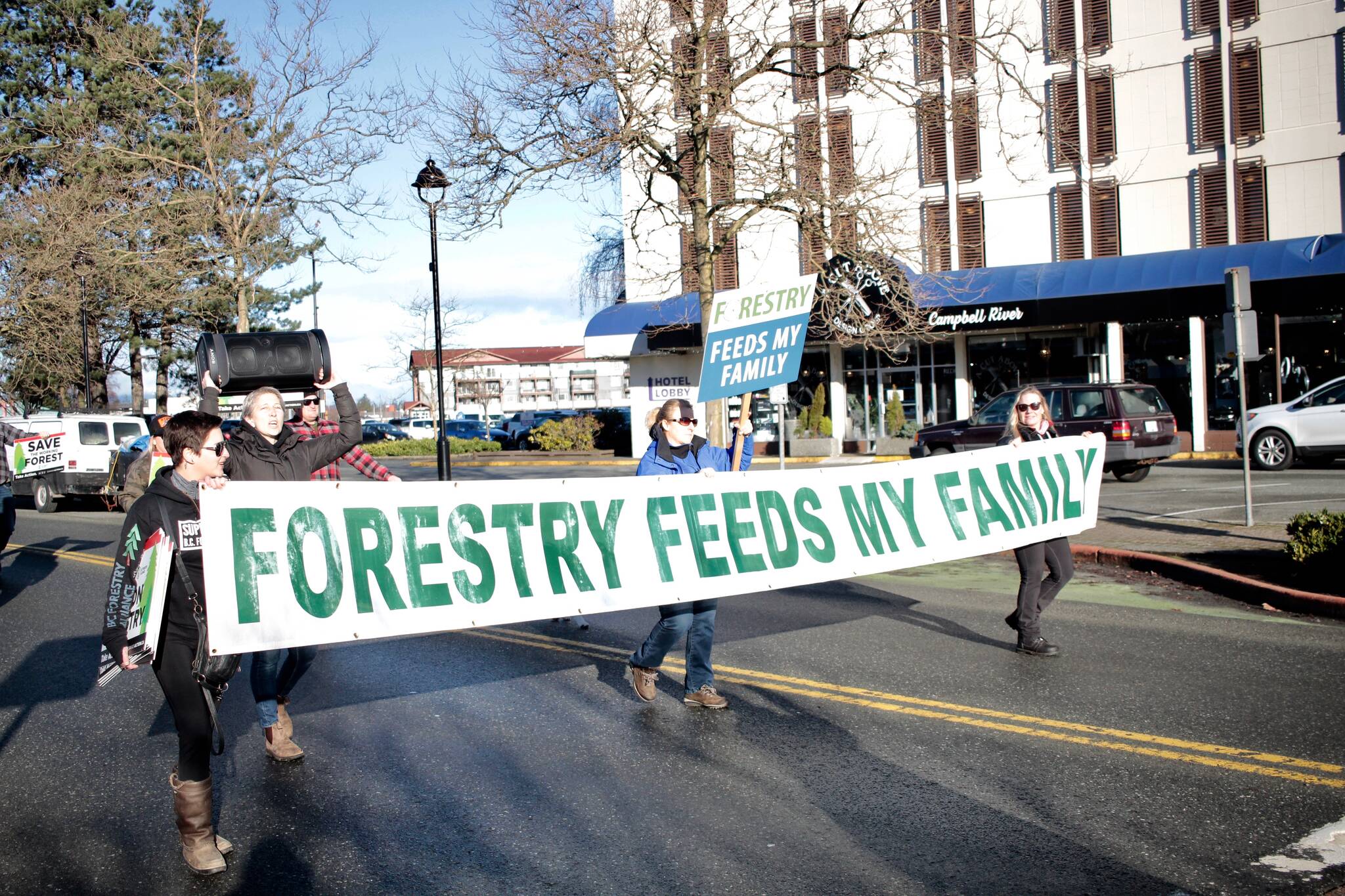 People supporting the forestry industry walk down Shoppers Row in Campbell River. Photo by Marc Kitteringham / Campbell River Mirror