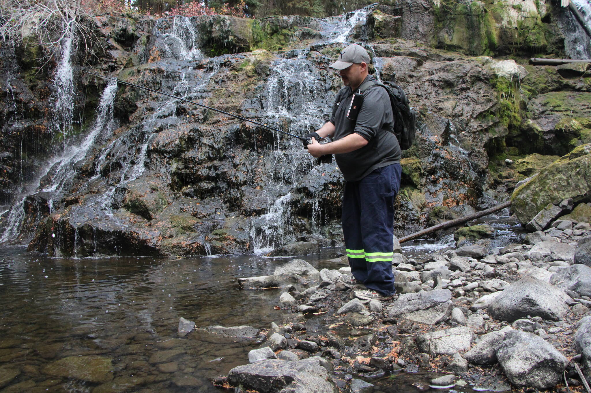 Randy Dodd fishes in a pool by Bridge Creek Falls back in 2021. (Patrick Davies photo - 100 Mile Free Press)