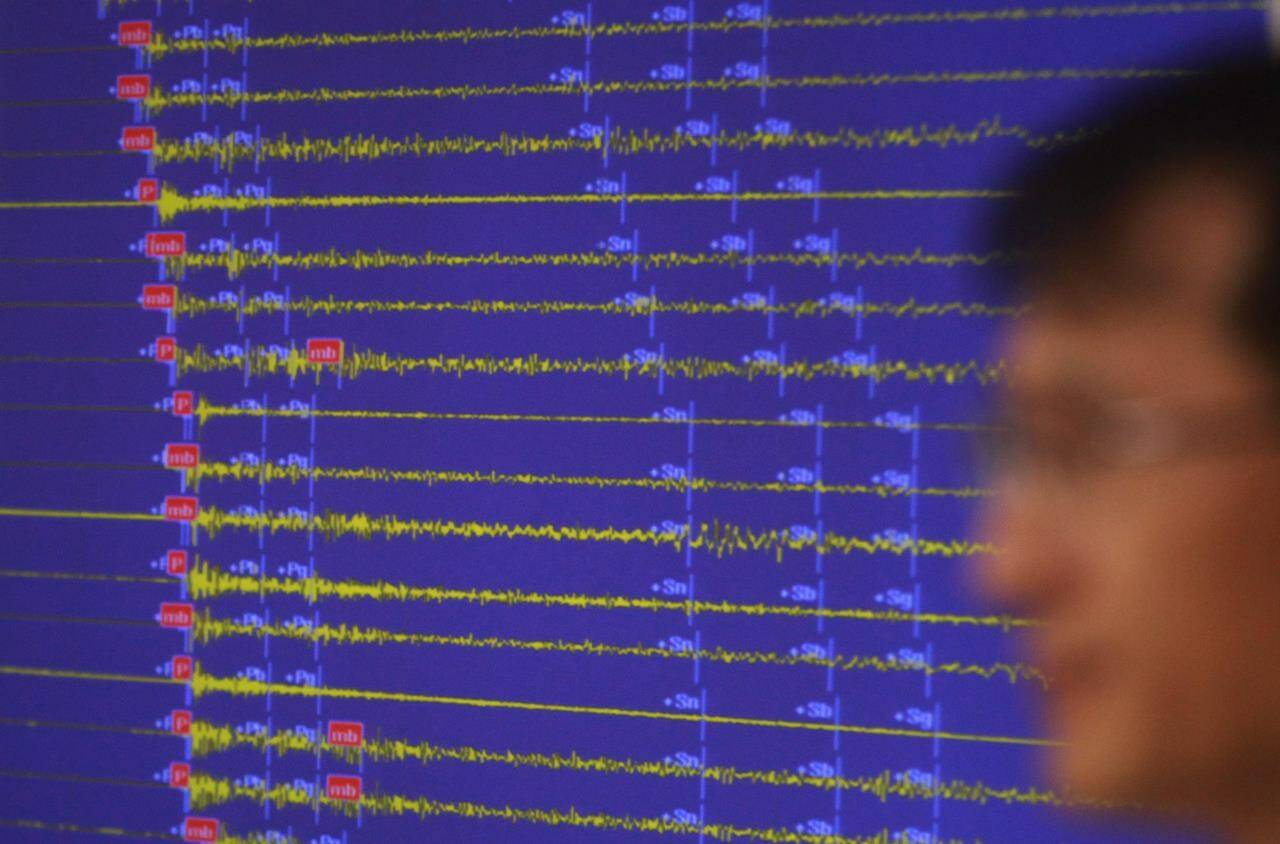Earthquake and Volcano of the Korea Monitoring Division Director Ryoo Yong-gyu speaks in front of a screen showing seismic waves that were measured in South Korea, in Seoul, South Korea, Friday, Sept. 9, 2016. New research says the largest recorded earthquake in Alberta’s history was not a natural event but most likely caused by disposal of oilsands wastewater. THE CANADIAN PRESS/AP, Ahn Young-joon