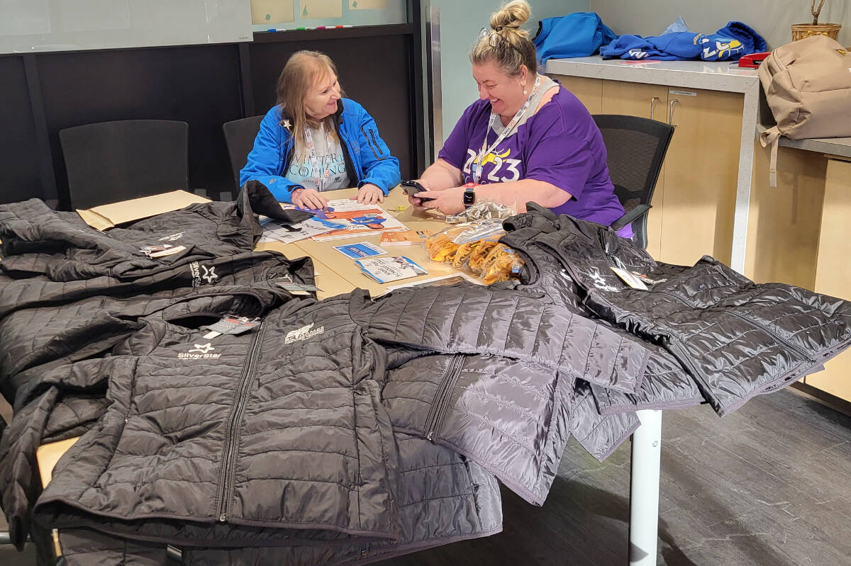 Greater Vernon B.C. Winter Games vice-president Cindy Masters (left) and director of marketing Lara Konkin go over some last-minute details at the Games’ media centre Thursday, March 23. The Games start tonight with the opening ceremonies at 7 p.m. at Kal Tire Place. Competition in the 15 sports runs Friday to Sunday. (Roger Knox - Morning Star)