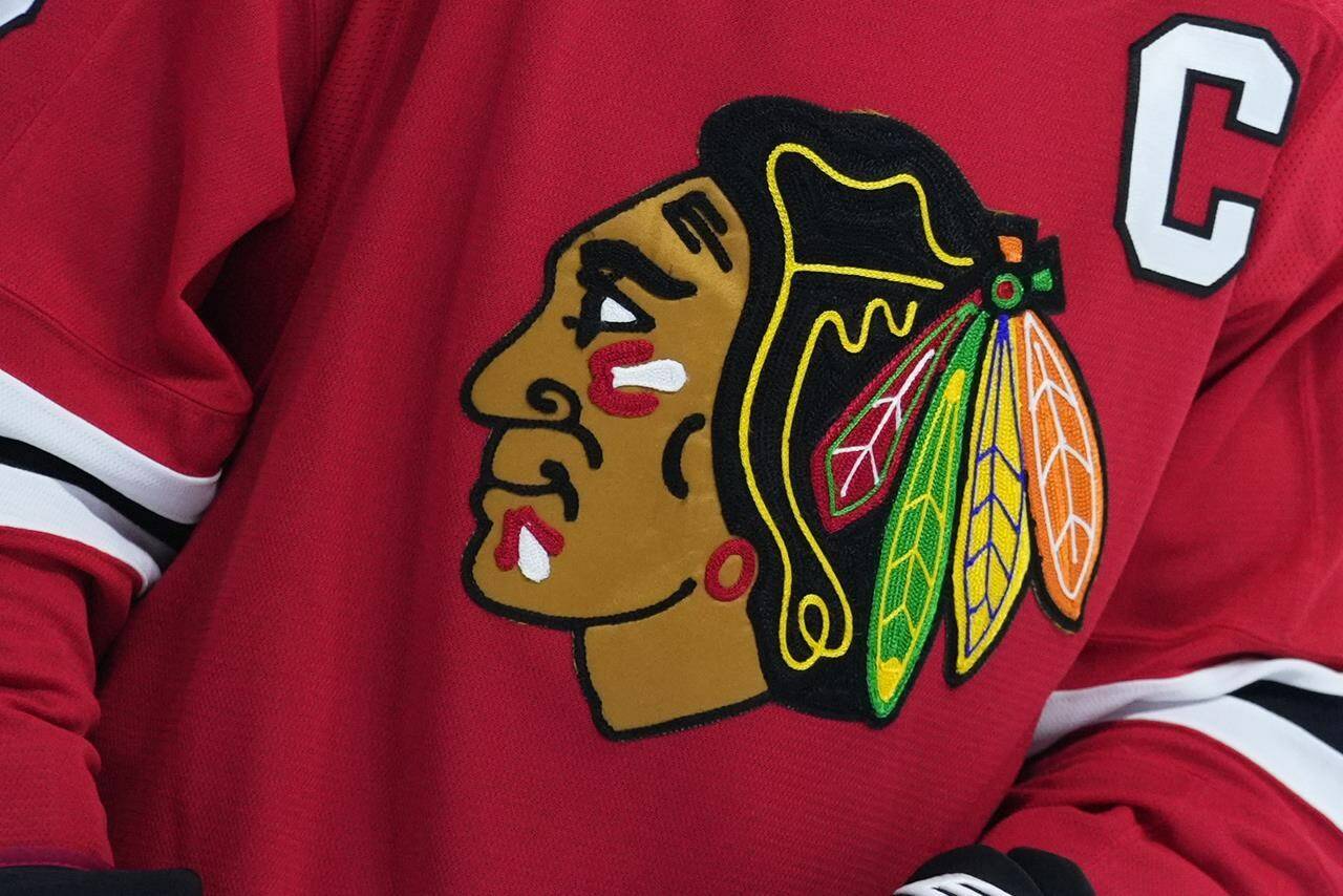 FILE - The Chicago Blackhawks’ logo is seen during an NHL hockey game on Jan. 19, 2023, in Philadelphia. The Blackhawks will not wear Pride-themed warmup jerseys before Sunday’s March 26, 2023, Pride Night game against Vancouver because of security concerns involving a Russian law that expands restrictions on activities seen as promoting LGBTQ rights in the country. (AP Photo/Matt Slocum, File)