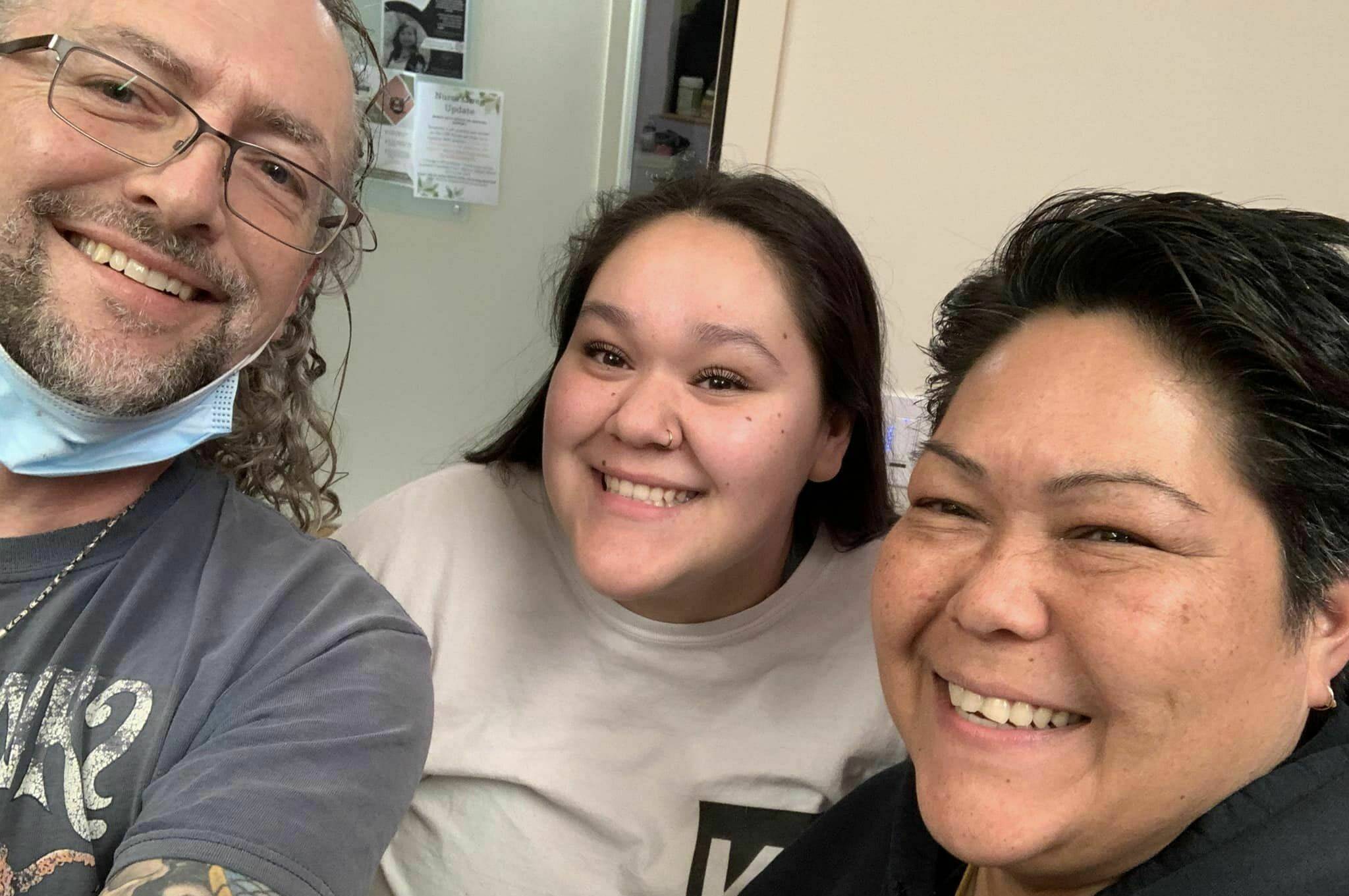 Creston tattoo artist poses with some of the participants of Paps and Tats. (Photo by Gerry Eyre)