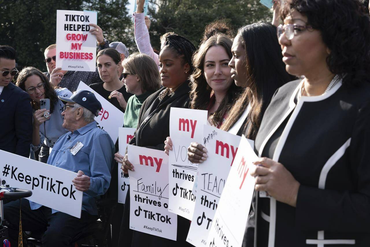 Supporters of TikTok hold signs during a rally to defend the app, Wednesday, March 22, 2023, at the Capitol in Washington. The House holds a hearing Thursday, with TikTok CEO Shou Zi Chew about the platforms consumer privacy and data security practices and impact on kids. (AP Photo/Jose Luis Magana)