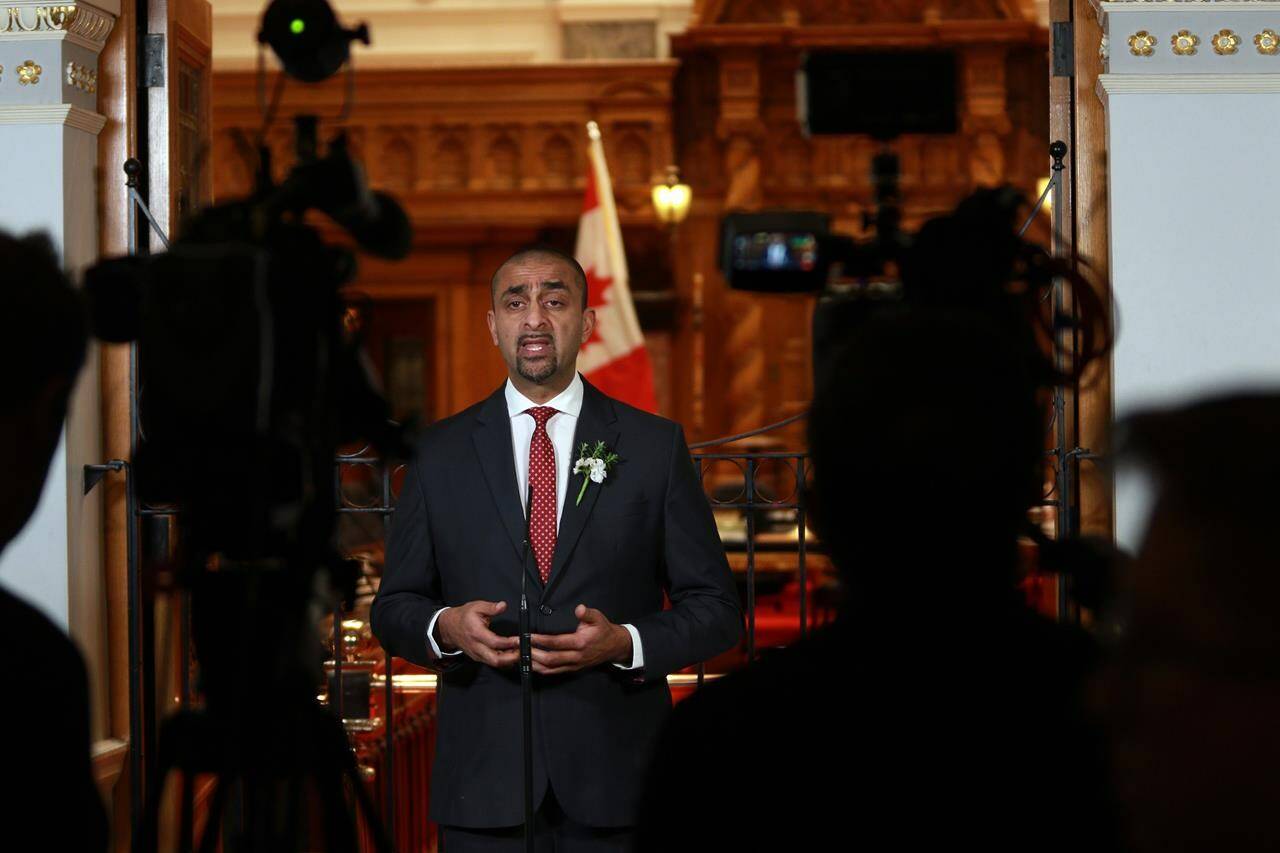 Then-Minister of Jobs, Economic Recovery and Innovation Ravi Kahlon answers questions from members of the media at the legislature in Victoria, B.C., on Monday, Feb. 6, 2023. The British Columbia government says it will be providing 330 new homes for people living on Vancouver’s Downtown Eastside by the end of June. THE CANADIAN PRESS/Chad Hipolito