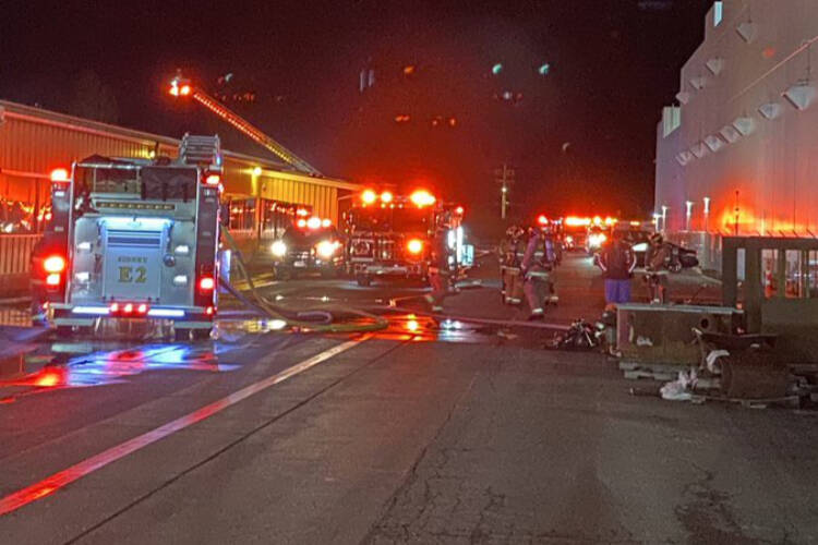 Crews from Sidney, Central Saanich and North Saanich fire departments douse a Sidney structure fire early Sunday morning. (Sidney Volunteer Fire Department/Twitter)