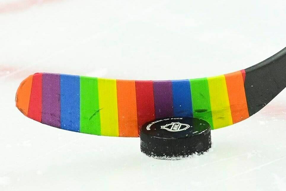 An Ottawa Senators player warms-up with rainbow coloured hockey tape as part of a #HockeyIsForEveryone campaign prior to taking on the Vancouver Canucks in NHL hockey action in Ottawa on Wednesday, April 28, 2021. The Vancouver Canucks will wear themed warm-up jerseys when they host the Calgary Flames for their annual Pride celebration game Friday. THE CANADIAN PRESS/Sean Kilpatrick