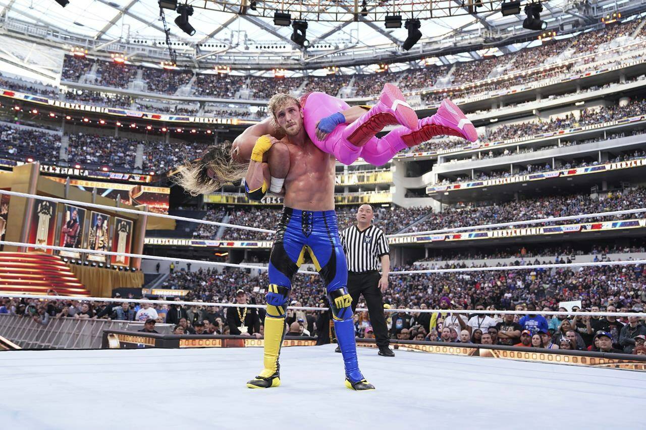 In this photo provided by WWE, social media star Logan Paul faces Seth Rollins during WrestleMania 39 on Saturday, April 1, 2023, at SoFi Stadium in Inglewood, Calif. This was the second straight year Paul was in a match in WWE’s signature event. (WWE via AP)