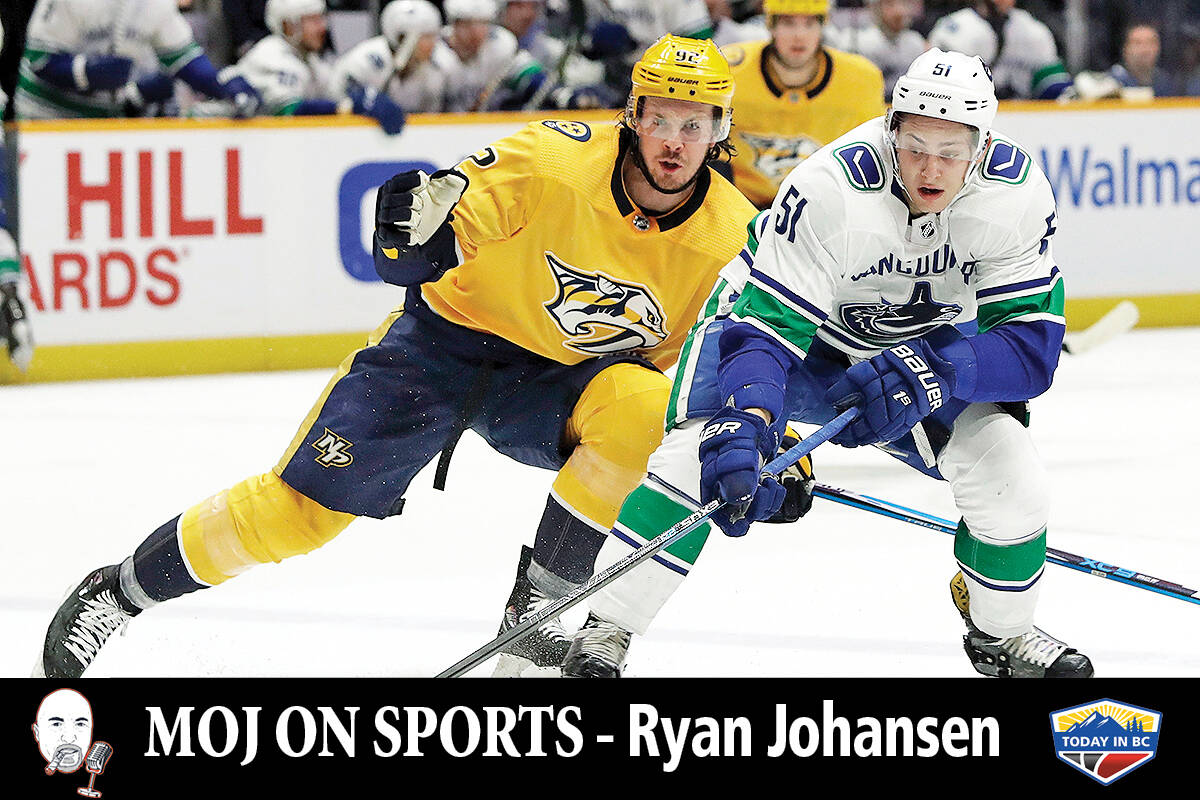 Nashville Predators centre Ryan Johansen (92) and Vancouver Canucks defenceman Troy Stecher (51) chase after the puck Thursday, Dec. 13, 2018, in Nashville, Tenn. (AP Photo/Mark Humphrey)