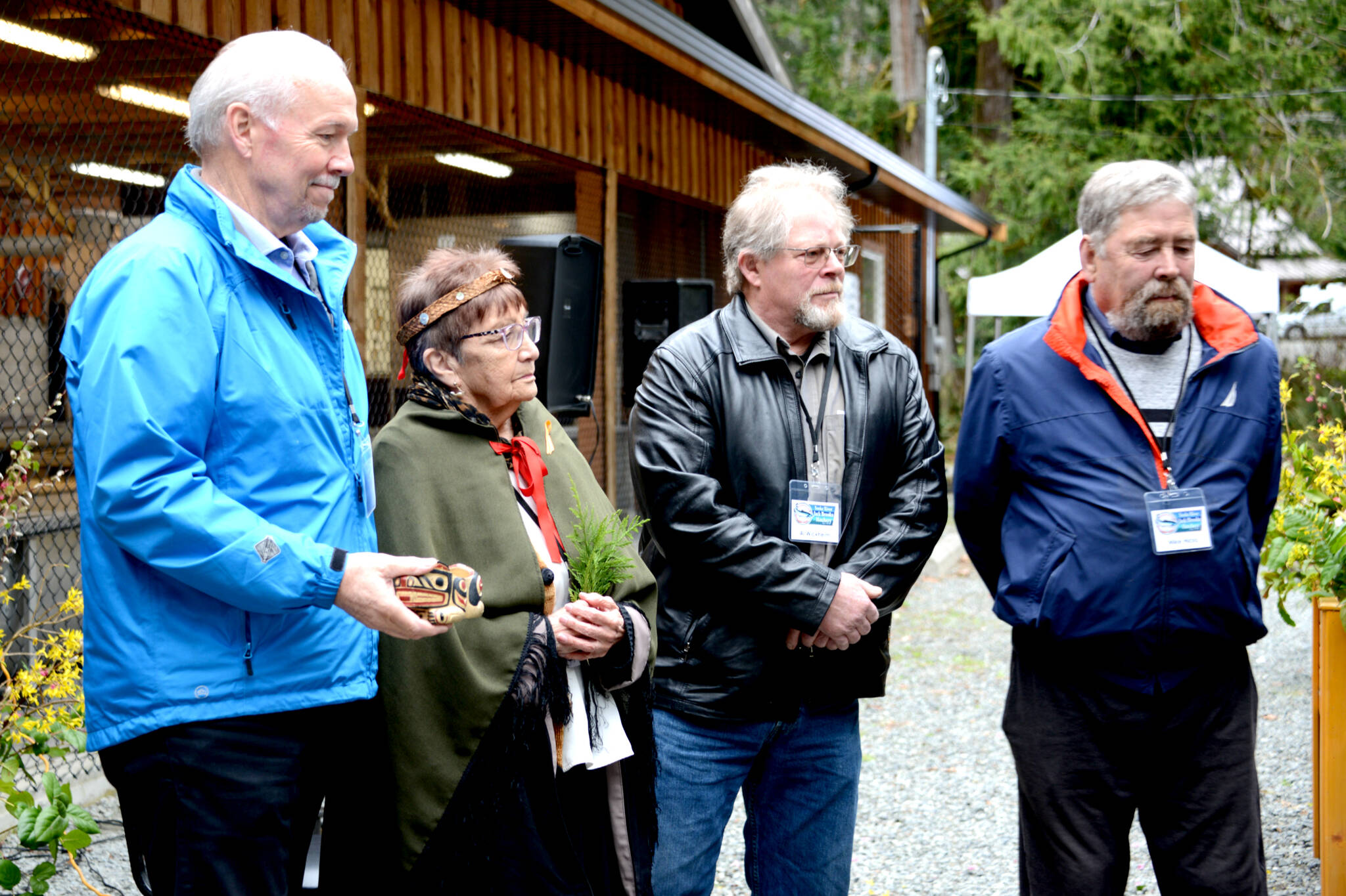 Former premier John Horgan (left), T-Sou-ke Nation elder Shirley Alphonse, Juan de Fuca Electoral Area director Al Wickheim, and former CRD director Mike Hicks take part in grand opening ceremonies for Sooke River Jack Brooks Hatchery on Saturday. (Photo by Kerrie Reay)