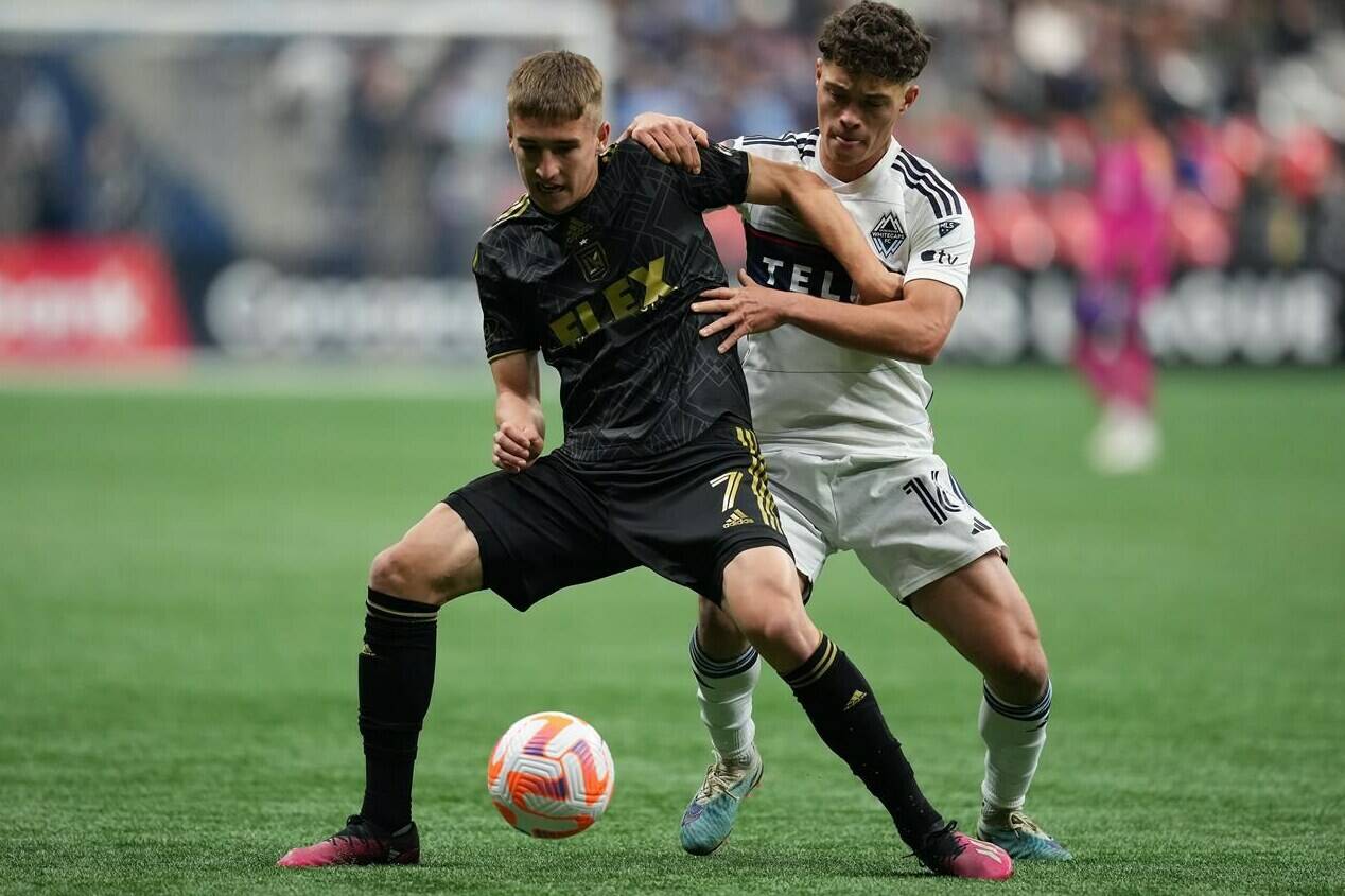 Los Angeles FC’s Stipe Biuk, front left, and Vancouver Whitecaps’ Sebastian Berhalter vie for the ball during the second half of a CONCACAF Champions League quarterfinal soccer match, in Vancouver, on Wednesday, April 5, 2023. THE CANADIAN PRESS/Darryl Dyck