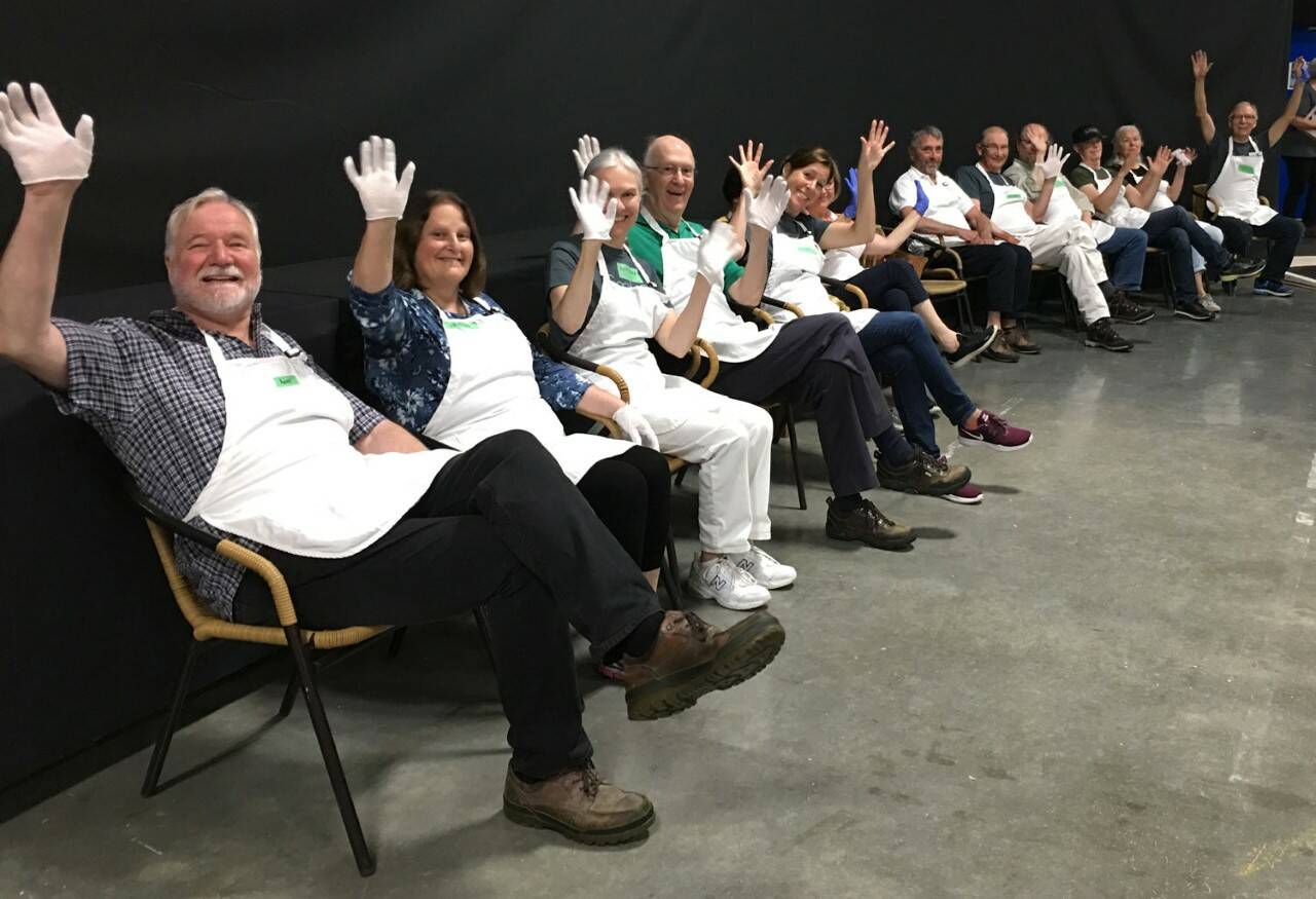 Volunteering at the Sooke Fine Arts Show has been known to bring a smile to participants. (Photo contributed)