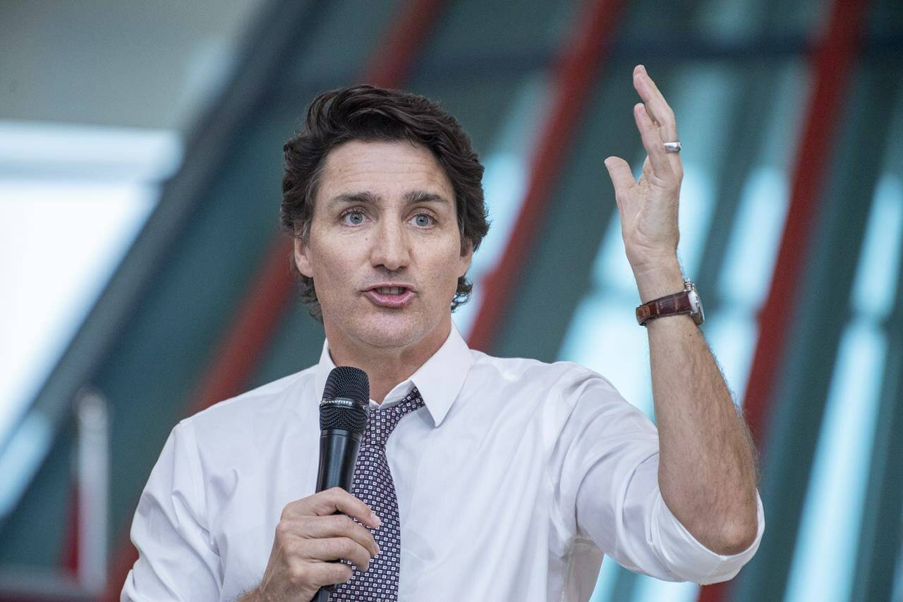 Prime Minister Justin Trudeau speaks at a town hall at the First Nations University of Canada in Regina, Thursday, April 13, 2023. Every town hall begins the same way: Prime Minister Justin Trudeau arrives in a blue a white shirt with rolled-up sleeves, takes the microphone, waxes poetic about the state of the world and acknowledges the challenging years Canadians have recently faced. THE CANADIAN PRESS/Liam Richards