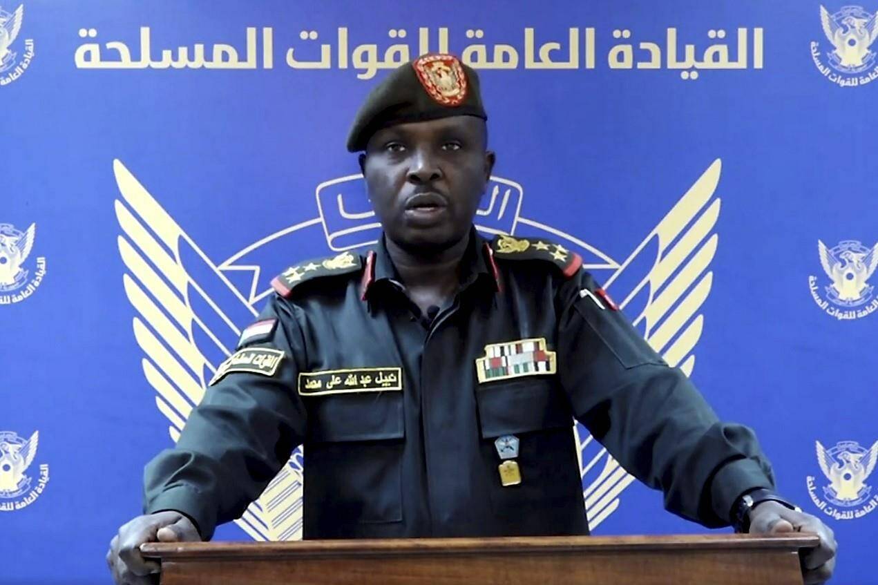 In this frame grab from a video posted by Sudan’s state news agency, SUNA on Thursday, April 13, 2023, spokesman for the Sudanese Armed Forces Brig. Nabil Abdullah reads a statement warning of conflict after the recent deployment of Sudan’s powerful paramilitary in the capital and other cities. Tensions between the military and the paramilitary, the Rapid Support Forces (RSF), have escalated in recent months, forcing a delay of the signing of an internationally-backed deal with political parties to restore the country’s democratic transition. In the statement, the military said the buildup of the RSF in Khartoum and elsewhere in the country has come without “the approval of, or coordination with” the armed forces’ leadership. (SUNA via AP)