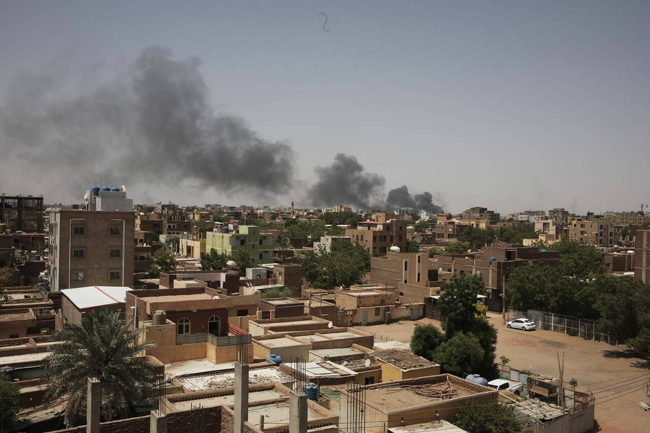 Smoke is seen in Khartoum, Sudan, Saturday, April 22, 2023. Ottawa says it’s working on ways to try evacuating Canadians out of Sudan, and is asking them to register with Global Affairs Canada. THE CANADIAN PRESS/AP, Marwan Ali