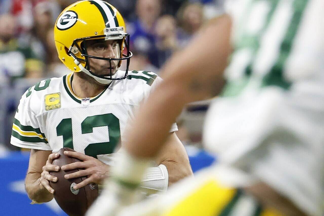 CORRECTS TO GREEN BAY PACKERS' AARON RODGERS NOT LIONS TIM BOYLE AND ADDS NEW SECOND SENTENCE - FILE - Green Bay Packers quarterback Aaron Rodgers (12) looks to pass in the second half against the Detroit Lions during an NFL football game Nov. 6, 2022, in Detroit. The New York Jets signed quarterback Tim Boyle to a one-year contract as a backup Thursday, April 6, 2023. Boyle served as a backup in Green Bay for three seasons to Rodgers who said last month his intention is to play for the Jets this season. (AP Photo/Rick Osentoski, File)