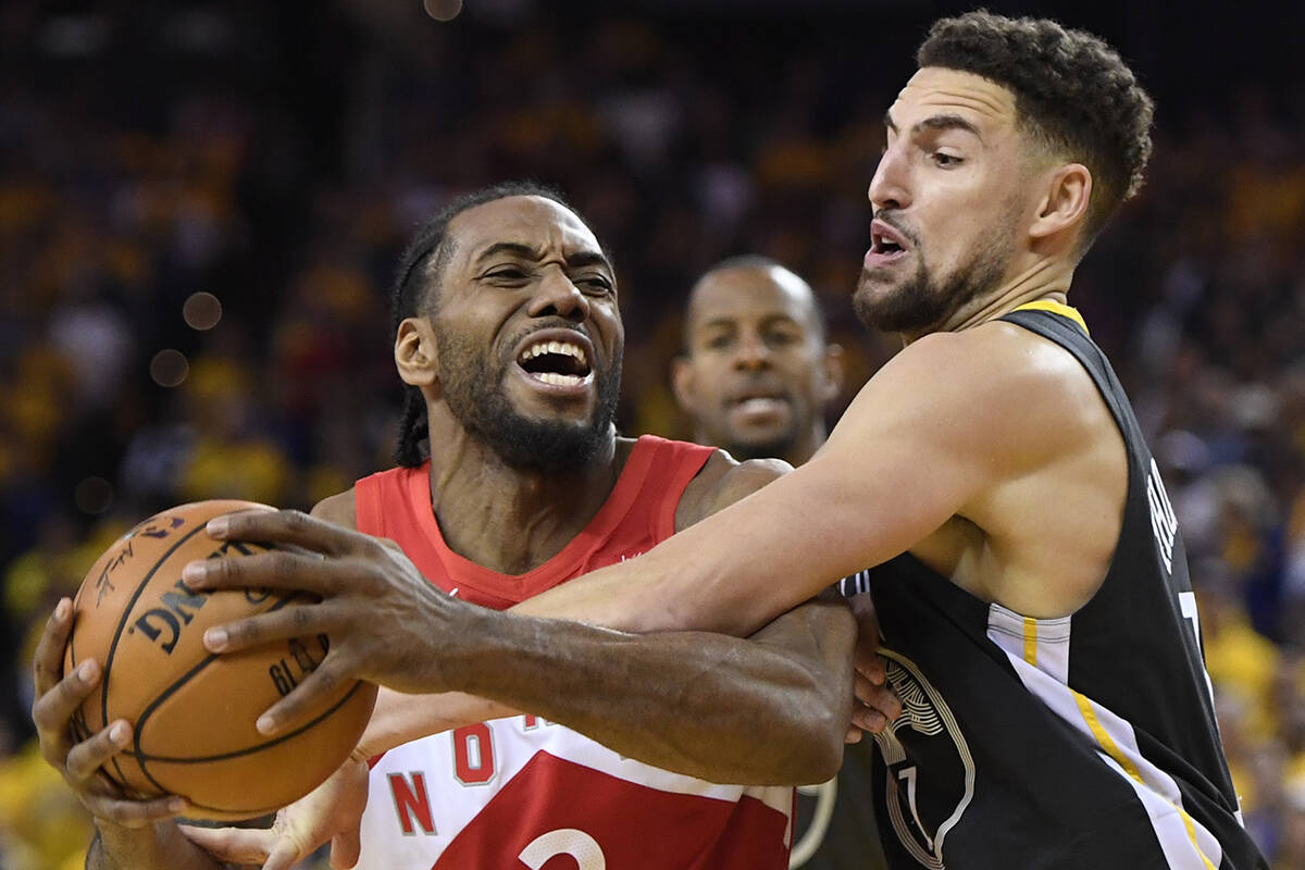 Toronto Raptors forward Kawhi Leonard (2) battles Golden State Warriors guard Klay Thompson (11) during second half basketball action in Game 4 of the NBA Finals in Oakland, California on Friday, June 7, 2019. THE CANADIAN PRESS/Frank Gunn
Toronto Raptors forward Kawhi Leonard (2) battles Golden State Warriors guard Klay Thompson (11) during second half basketball action in Game 4 of the NBA Finals in Oakland, California on Friday, June 7, 2019. THE CANADIAN PRESS/Frank Gunn