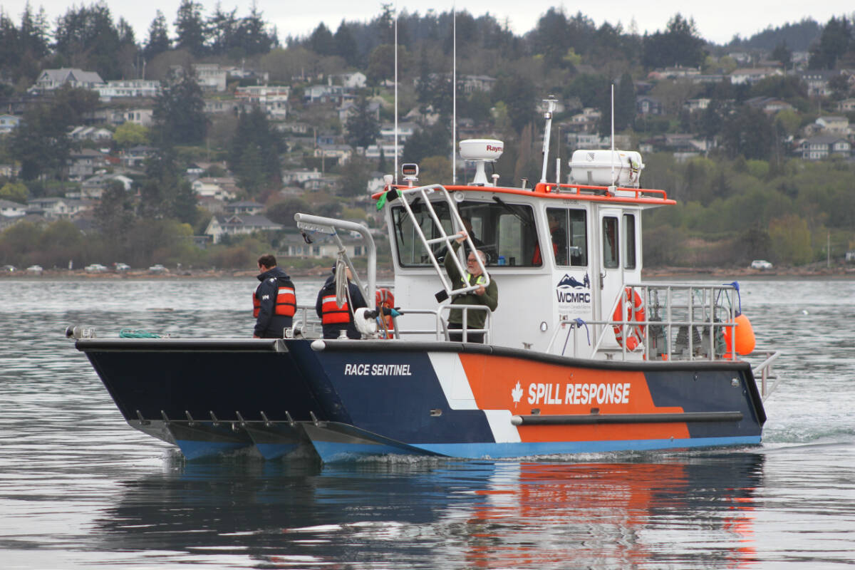 Crews with the Western Canada Marine Response Corporation conduct a simulated oil spill outside Esquimalt Harbour April 26. (Austin Westphal/News Staff)