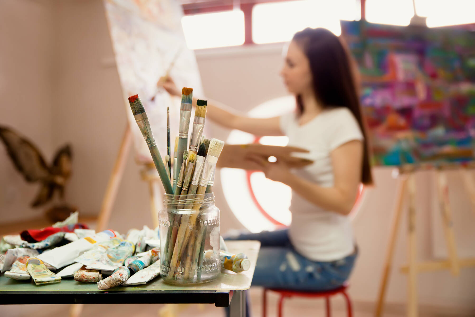 An artist working on a painting in a studio. Sooke is a member of the CRD arts commission. The commission supports, celebrates and promotes not-for-profit organizations in the region. (Shutterstock)